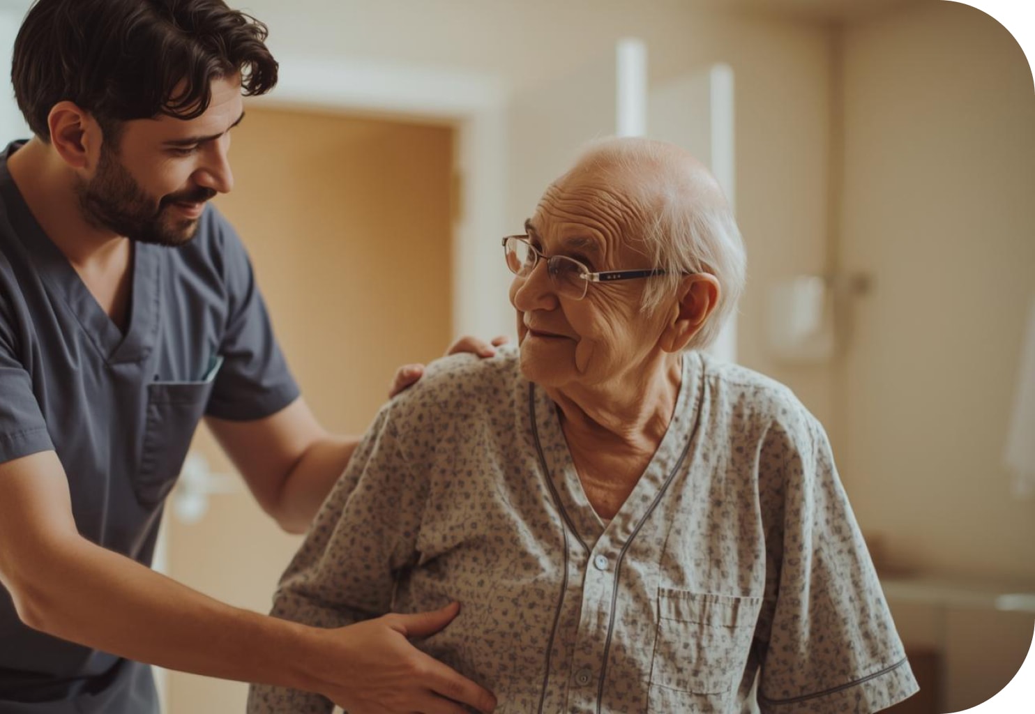 A caregiver supporting an older man with a warm smile